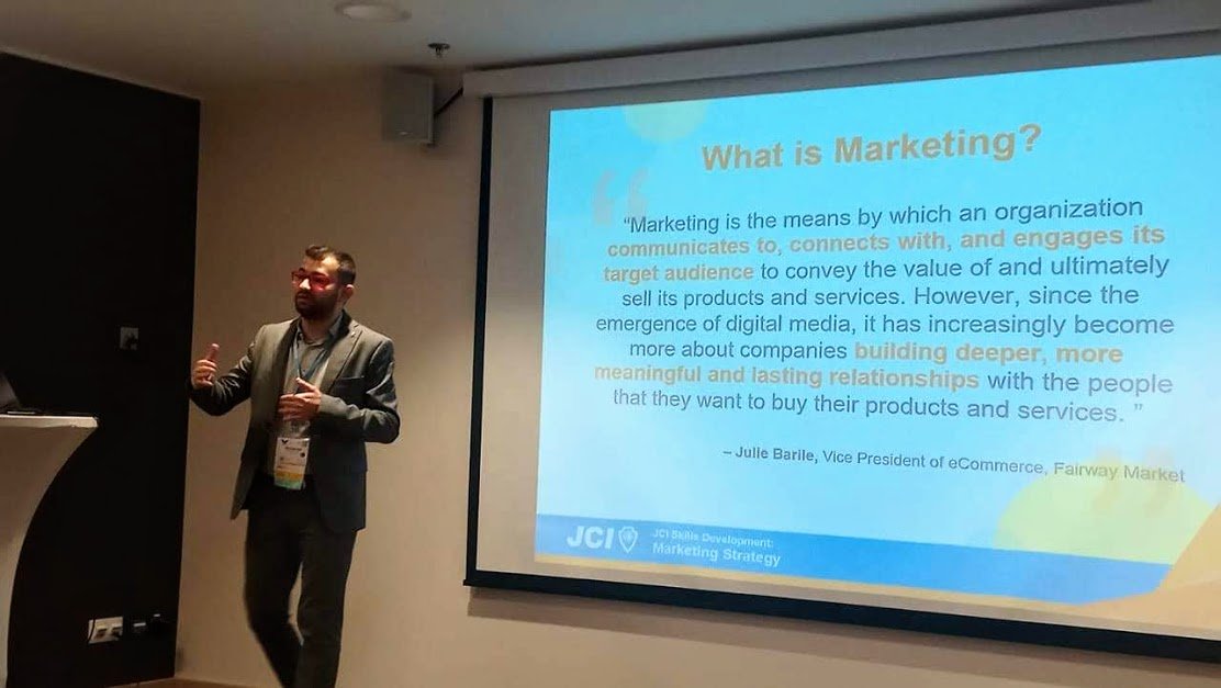 Mohammad Hijazi presenting a 'What is Marketing?' training session